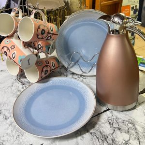 6 pcs blue ceramic plates , 6 pcs orange/white mugs and 3 ltr chocolate jp flask
